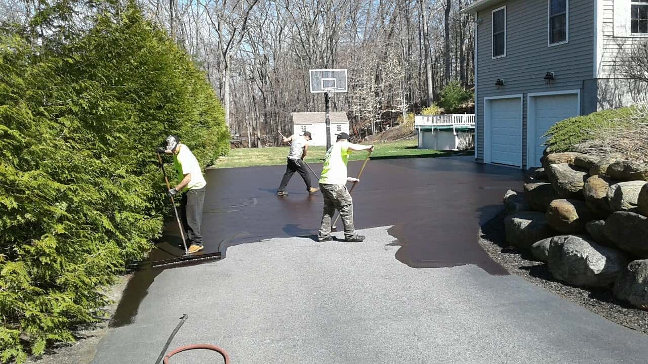 crew sealing driveway